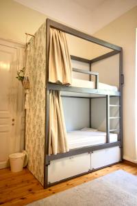 Uma cama ou camas num quarto em Baloo Hostel