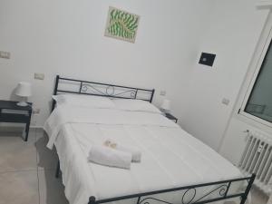 Postel nebo postele na pokoji v ubytování Fiordalisi home