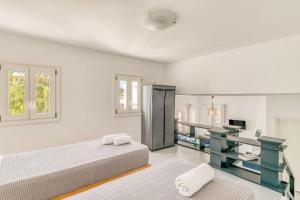Ένα ή περισσότερα κρεβάτια σε δωμάτιο στο Villa Asterias - Cycladic house close to the beach