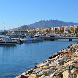 a marina with boats parked in the water at Newly renovated apartment in Garrucha