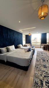 Postel nebo postele na pokoji v ubytování Grand Pyramids Inn