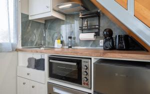 a kitchen with a sink and a microwave at View West Elafonisi house in Livadia