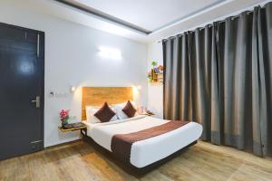 Postel nebo postele na pokoji v ubytování Hotel Wedlock Premium Huda City