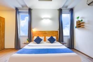 Postel nebo postele na pokoji v ubytování Hotel Wedlock Premium Huda City