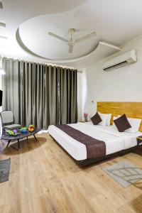 Postel nebo postele na pokoji v ubytování Hotel Wedlock Premium Huda City