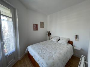 Ένα ή περισσότερα κρεβάτια σε δωμάτιο στο Appartement 6 pers totalement rénové