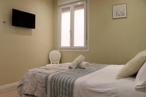 Posteľ alebo postele v izbe v ubytovaní HABITACION CENTRAL CON WIFI