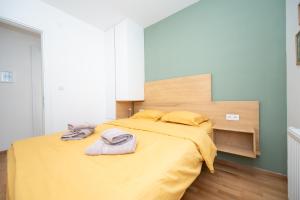 Letto o letti in una camera di Teo Divčigora