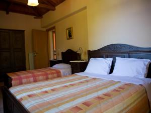Posteľ alebo postele v izbe v ubytovaní Alonissos Muses Villas + 37 fotografií