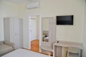 TV a/nebo společenská místnost v ubytování B&B Via delle 5 Terre