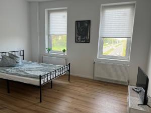 Postel nebo postele na pokoji v ubytování Live Smart in Altenburg Practical Apartments for Students and Workers