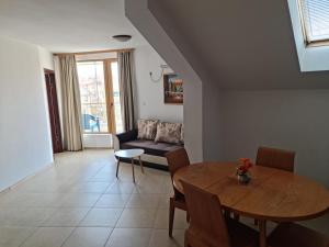 a living room with a table and a couch at Apartment Lermontov in Burgas