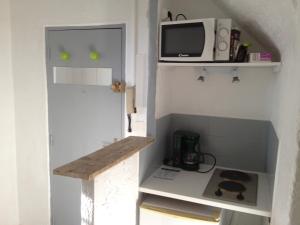 Kuchyň nebo kuchyňský kout v ubytování Appartement L'Atypique