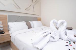 Кровать или кровати в номере Camel Pyramids View Inn