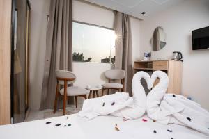 Кровать или кровати в номере Camel Pyramids View Inn