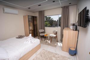 Кровать или кровати в номере Camel Pyramids View Inn