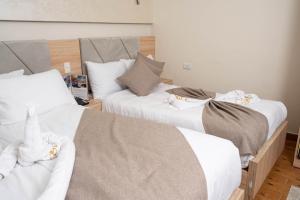 Кровать или кровати в номере Camel Pyramids View Inn
