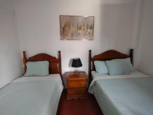 Een bed of bedden in een kamer bij Hotel Casa de Copan