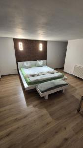 a bedroom with two beds and two lights on the wall at Matei Rent Apartments - Premium Stays & Free Parking in Baia Mare +87 photos