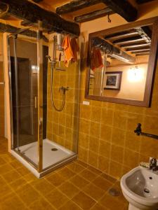 a bathroom with a shower and a toilet and a sink at il Pozzo Apartment in Città di Castello +18 photos