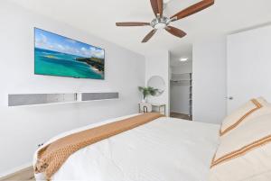 Ένα ή περισσότερα κρεβάτια σε δωμάτιο στο Waikiki Blue View +14 φωτογραφίες