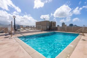 a swimming pool on top of a building at Waikiki Blue View in Honolulu