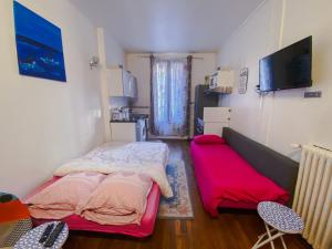 Ένα ή περισσότερα κρεβάτια σε δωμάτιο στο Nice Apartment ideal to visit Paris