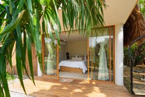 En eller flere senge i et værelse på VelaNova Paradise - HotelRetreat