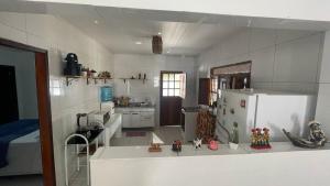 a model of a kitchen with a refrigerator at Casa do Arnaldinho in São Miguel dos Milagres