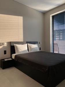 Кровать или кровати в номере Dreamside Apartment Chakvi