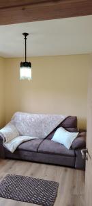 a bed sitting in a room with a ceiling at Casa Mondinense in Mondim de Basto