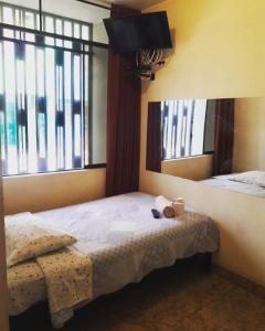 Postel nebo postele na pokoji v ubytování Hostal Kmr