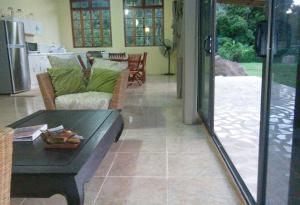 a living room with a couch and a table at Ocean Plateau in Motu Tiahura