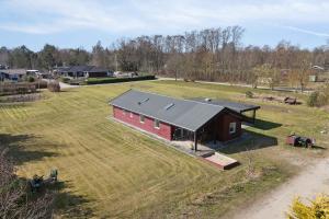 an aerial view of a red barn in a field at Lovely Bright House Near The Beach In Nature in Ørsted