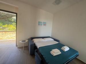 Ένα ή περισσότερα κρεβάτια σε δωμάτιο στο Borgo ninni - CASA DEBBY