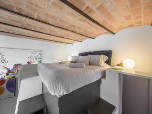 Posteľ alebo postele v izbe v ubytovaní Over The Tiber Loft