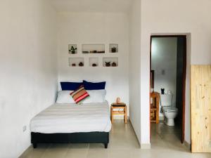 Ένα ή περισσότερα κρεβάτια σε δωμάτιο στο Cabañas Alta Vista