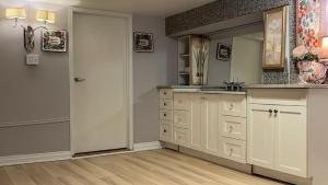 a bathroom with a sink and a mirror at Renovated 2 Queen Beds Unit with Private Kitchen and Bathroom Near Yonge Street Basement in Richmond Hill