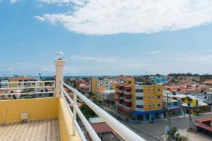 a view of a city from a balcony at 2 Bedroom Apartment in Corales del Sur - Parque del Este - Las Americas Airport in La Viva