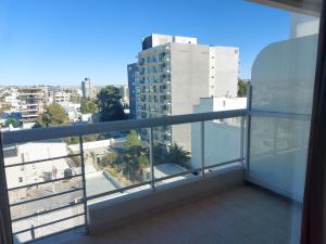 a balcony with a view of a city at Departamento Céntrico in Puerto Madryn +1 photo