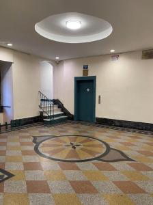 a room with a clock on the floor with a door at 2-Bedroom Apartment in the Bronx and Pet Friendly in Bronx