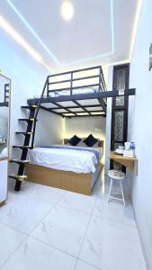 Postel nebo postele na pokoji v ubytování Laswi Syariah Guest House