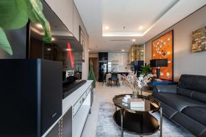 a living room with a couch and a table at Madison modern 2br unit in Ho Chi Minh City