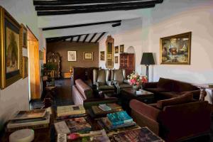 a living room with couches and a table at Empedrada Ranch & Lodge - Hotel Asociado Casa Andina in Caral