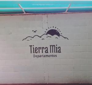 a sign for the terra mita departments on a wall at Tierra Mia II in Carpintería
