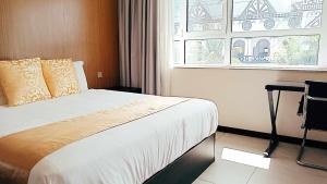 Tauese Seaview Hotel客房内的一张或多张床位