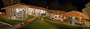 a large building with lights on it at night at Dantica Cloud Forest Lodge in San Gerardo de Dota +72 photos