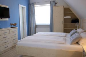 Postel nebo postele na pokoji v ubytování Mein Inselhotel