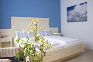 Postel nebo postele na pokoji v ubytování Mein Inselhotel