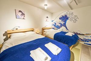 Tempat tidur dalam kamar di IZURU Shiba Hamamatsucho 3F